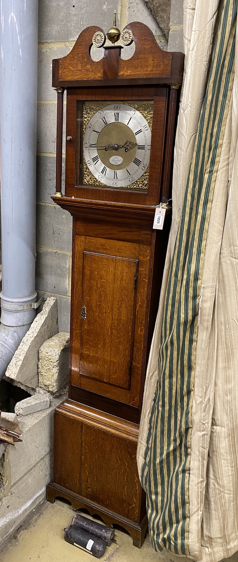 An early 19th century mahogany and banded oak eight day longcase clock marked Thomas Quested, Wye, height 206cm